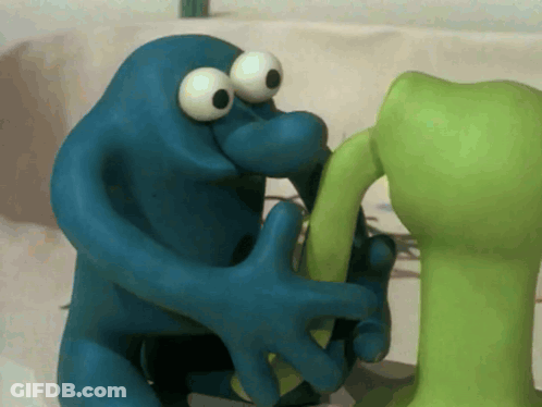 Blue Monster Holding Green Object GIF