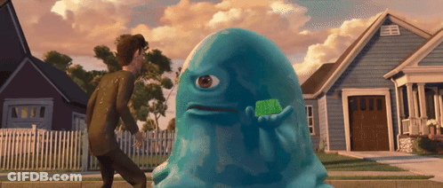 Blue Monster Holding Green Object GIF