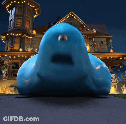 Blue Monster In Front Of Haunted House Saying Happy Halloween GIF
