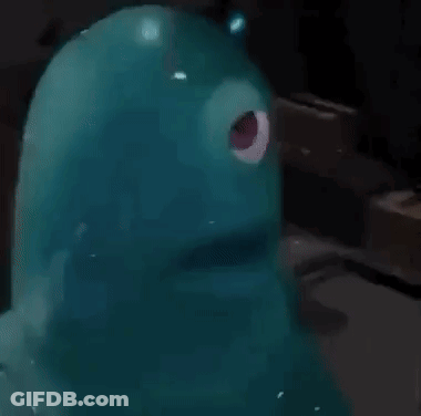 Blue Monster With Red Eye Standing On Table GIF