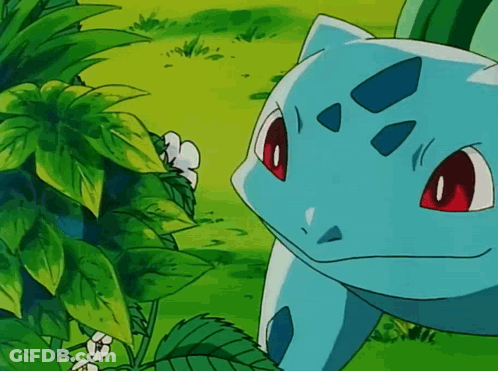 Blue Pokemon With Red Eyes Peeking Behind Leaves GIF