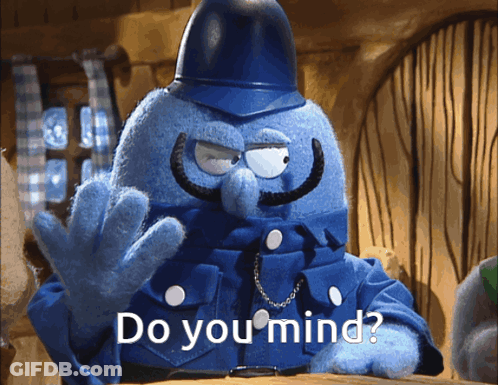 Blue Puppet With Mustache And Helmet Says Do You Mind GIF