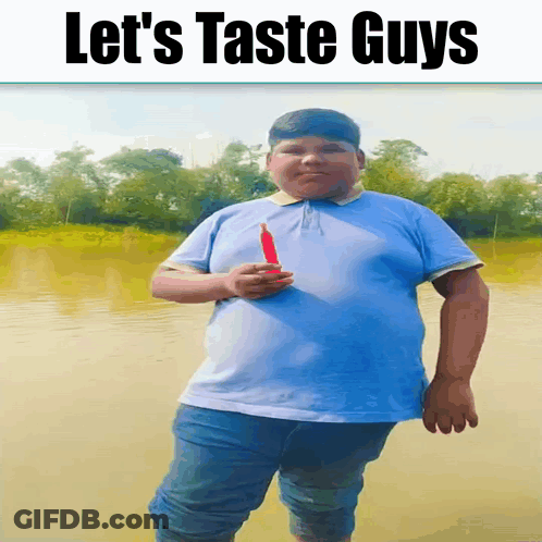 Blue Shirt Boy Holding Red Object Let's Taste Guys GIF