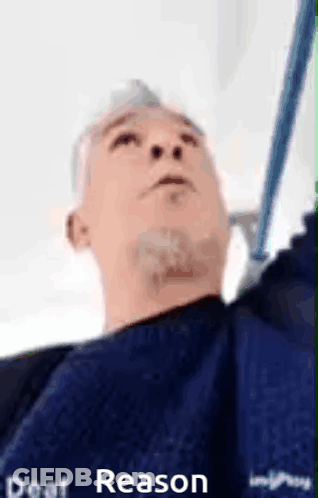 Blue Shirt Man Holding Mop Looking Up GIF