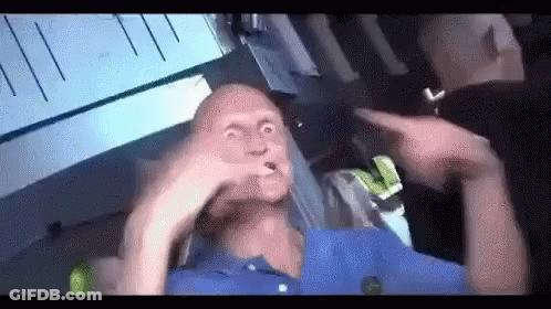 Blue Shirt Man Making Funny Face, Man Points GIF