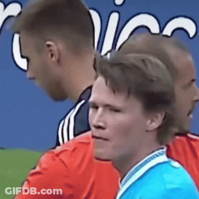 Blue Shirt Man Next To Red Jersey Man GIF