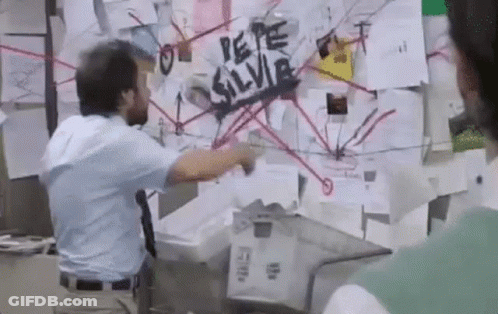 Blue Shirt Man Pointing At Bulletin Board Spider GIF