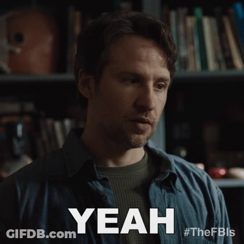 Blue Shirt Man Saying Yeah Bookshelf GIF