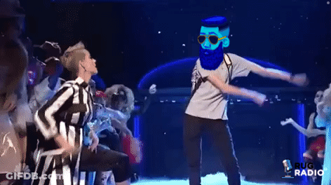 Blue Shirt Man With Glasses At Clothes Display GIF