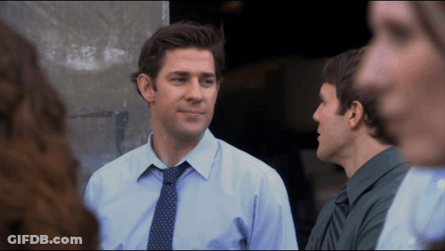 Blue Shirt Man With Tie Talking To Green Shirt Man GIF