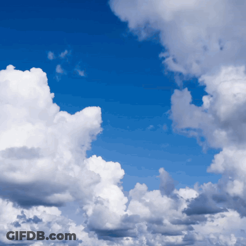 Blue Sky With White And Dark Clouds GIF