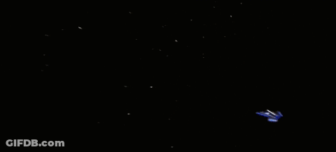 Blue Space Ship Flying Through Bright Light GIF