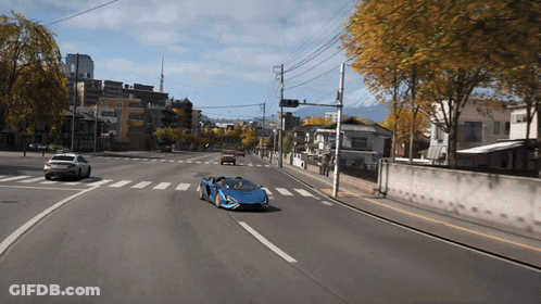Blue Sports Car Driving Down Road GIF