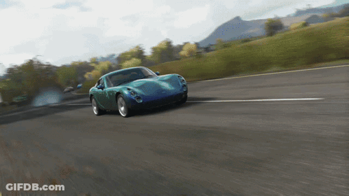 Blue Sports Car Driving Down Road GIF