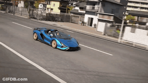 Blue Sports Car Driving Down Road GIF