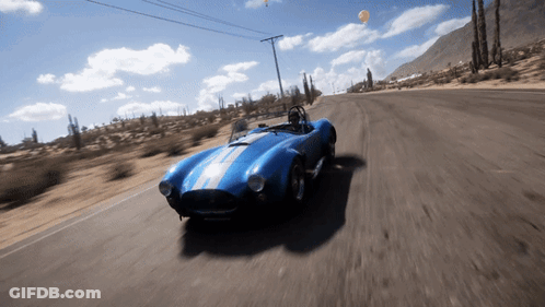 Blue Sports Car Driving In Desert GIF