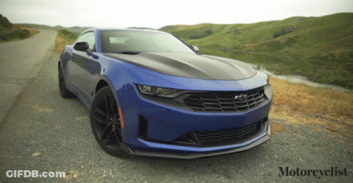 Blue Sports Car Parked On Road With Motorcyclist GIF