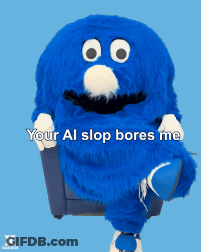 Blue Stuffed Animal In Chair Saying Your Al Slop Bores Me GIF