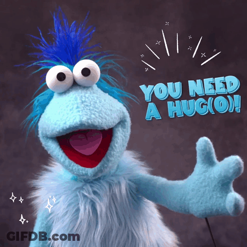 Blue Stuffed Animal With Blue Mohawk Saying You Need A Hug (O) GIF