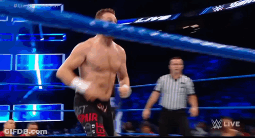 Blue Tank Top Wrestler Fighting Black Tank Top Wrestler GIF