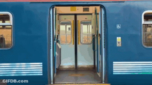 Blue Train With Open Doors And Handicapped Sign GIF