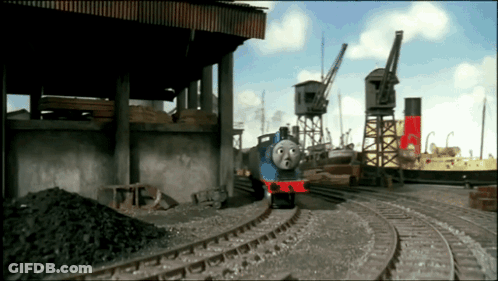 Blue Train With Red Stripe On Track GIF