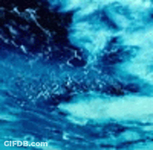 Blue Water Surface With Waves And Bubbles GIF