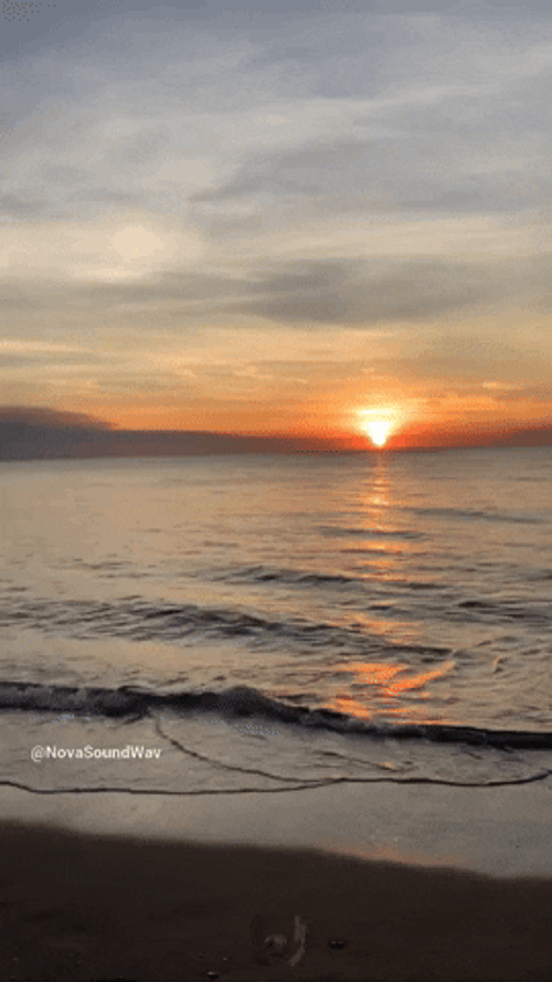 Blue Wave Flowing On Sunrise GIF