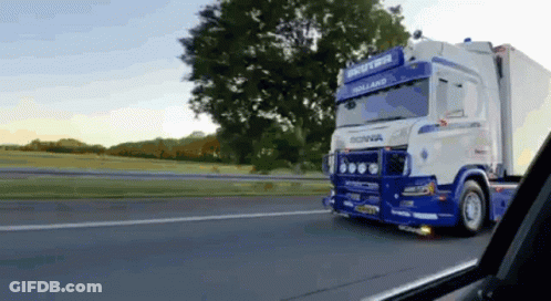 Blue White Scania Truck Driving Down Road GIF