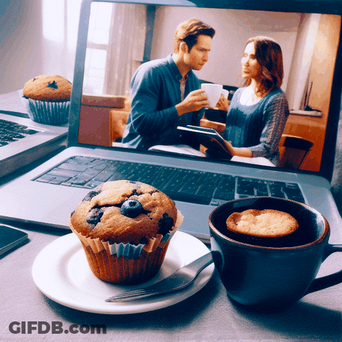 Blueberry Muffin On Plate Before Laptop GIF