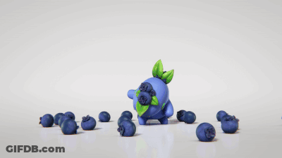 Blueberry With Green Leaf Surrounded By Blueberries GIF