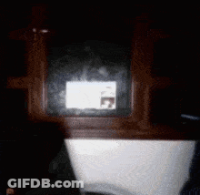 Blurred Box With Sticker Saying A GIF
