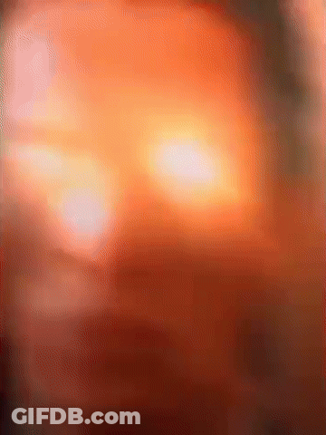 Blurred Face With Bright Orange Light GIF