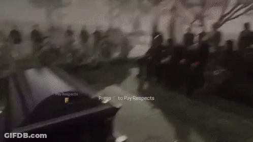 Blurred Group Of People Standing Around Table GIF