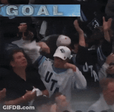 Blurred Group Of People With Goal Behind GIF