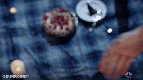 Blurred Hand With NBC Logo GIF