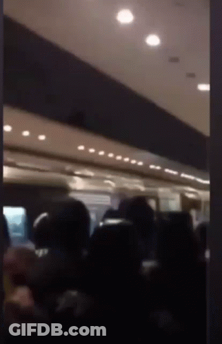 Blurred Image Of People Sitting On A Bus GIF