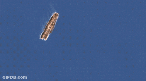 Blurred Image Of Plane Flying Through Sky GIF