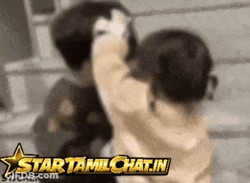 Blurred Image Of Two People With Startamilchat.in Star GIF