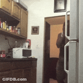 Blurred Kitchen With Picture Above Refrigerator GIF
