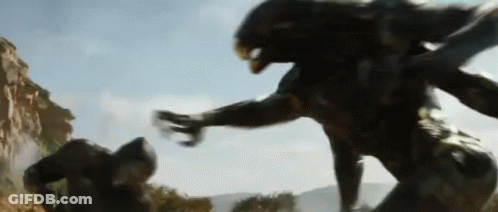 Blurred Man Fighting Monster In Field GIF