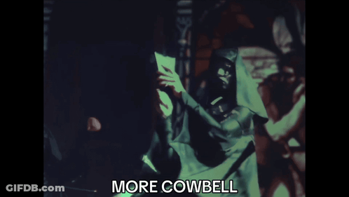 Blurred Man Holding Paper Saying More Cowbell GIF