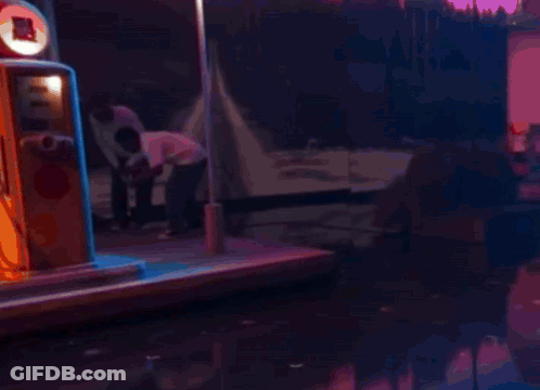 Blurred Man In Red Hat Driving Red Car GIF
