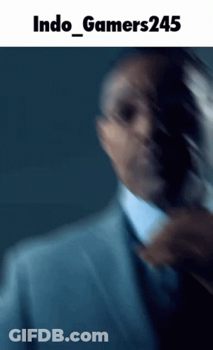 Blurred Man In Suit And Tie Saying Indo Gamers245 GIF