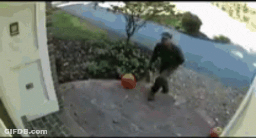 Blurred Man Walking On Sidewalk With Bag GIF