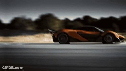 Blurred Orange Sports Car Driving GIF