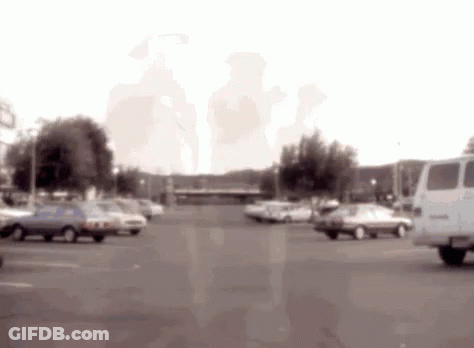 Blurred Parking Lot With Cars And Van GIF