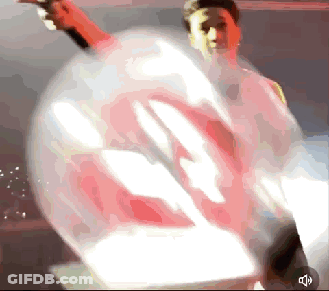Blurred Person Holding Balloon With Sound Button GIF