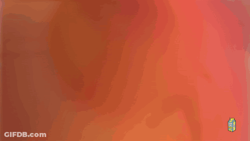 Blurred Person In Green Suit Holding Orange Balloon GIF