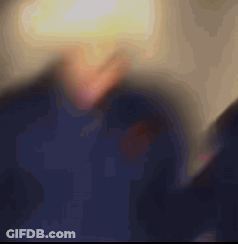 Blurred Person's Face With Yellow Light GIF